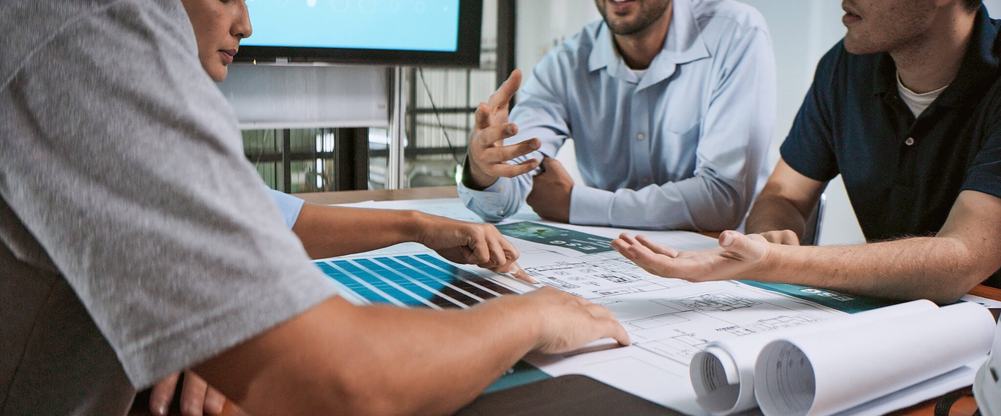 Team discussing technology infrastructure during a professional installation.