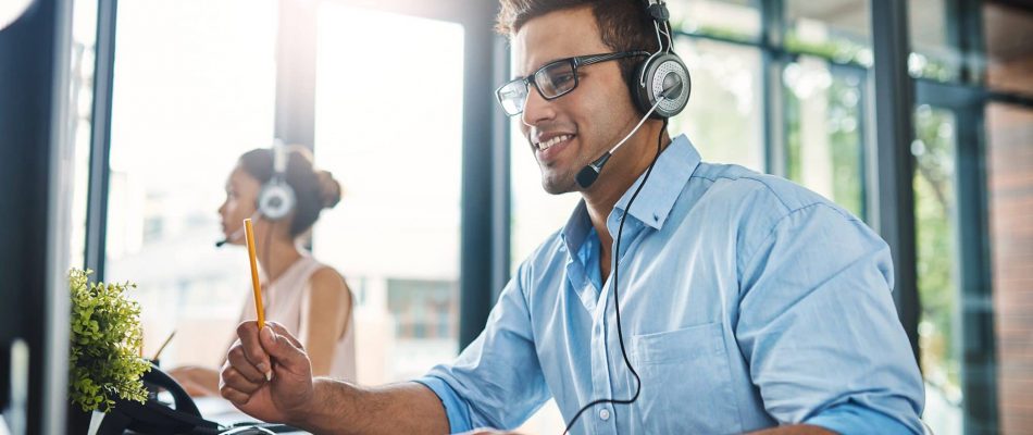 Customer support agent with headset working at call center in Jacksonville.