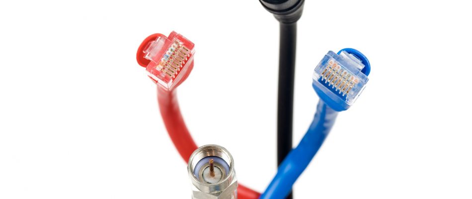 Close-up of red, blue, and black Ethernet cables with RJ45 connectors.