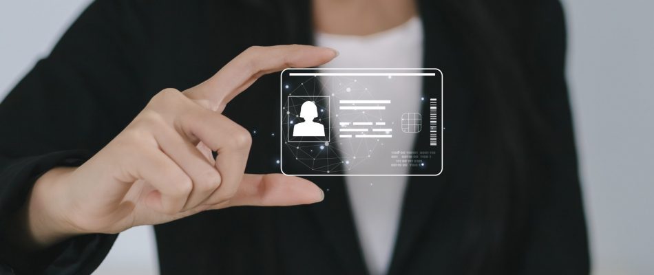 Person holding a digital access card with ID and security features.