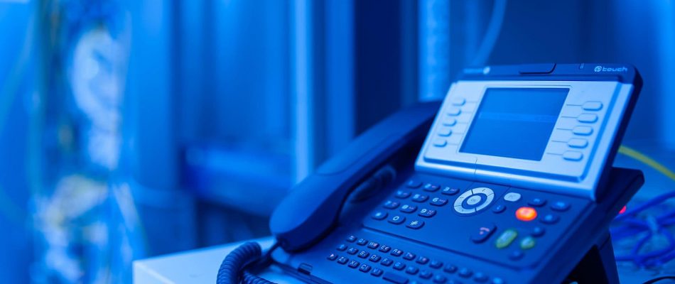 IP phone on desk for business communication in Jacksonville, Florida.