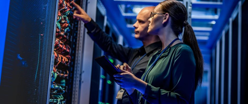Technicians testing and certifying network cabling in a data center.