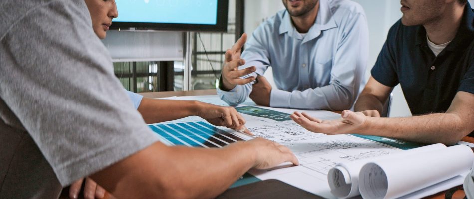 Team discussing technology infrastructure during a professional installation.