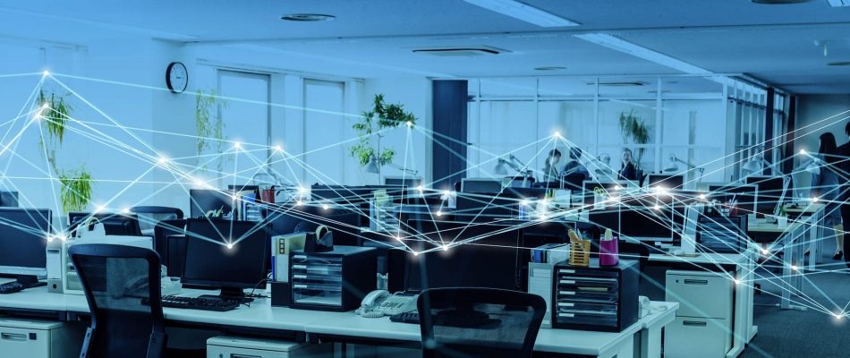 Open office space with interconnected digital devices and network lines.